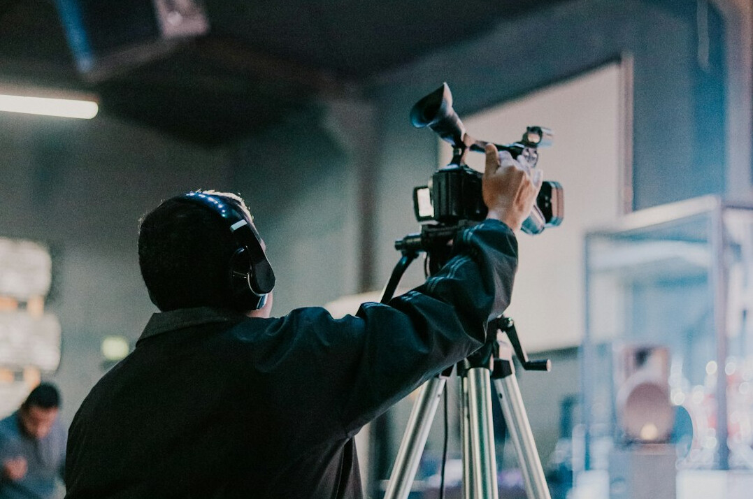 filmmaker reviewing footage on set