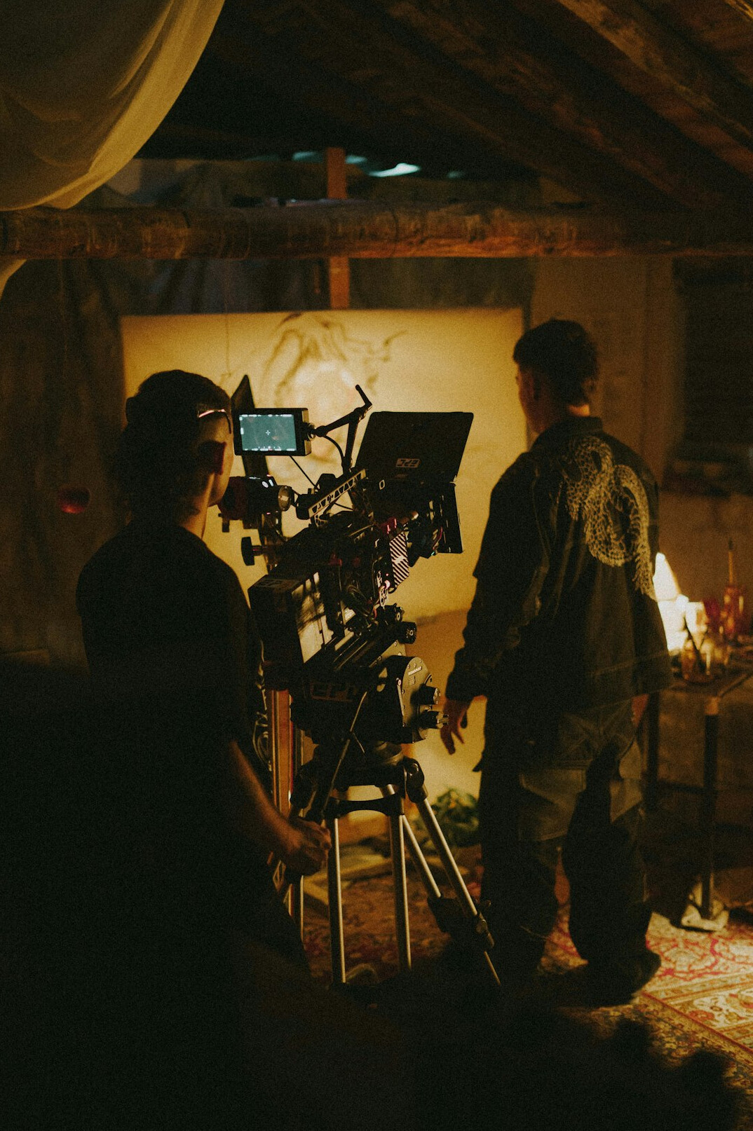 cinematographer adjusting film lights